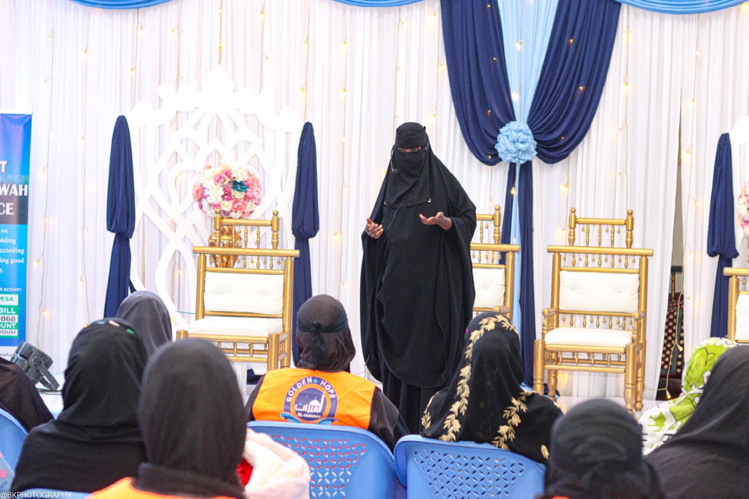 A teacher addresses women at a Golden Hope gathering